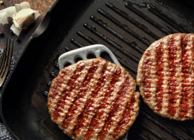 Hamburger patties on a grill
